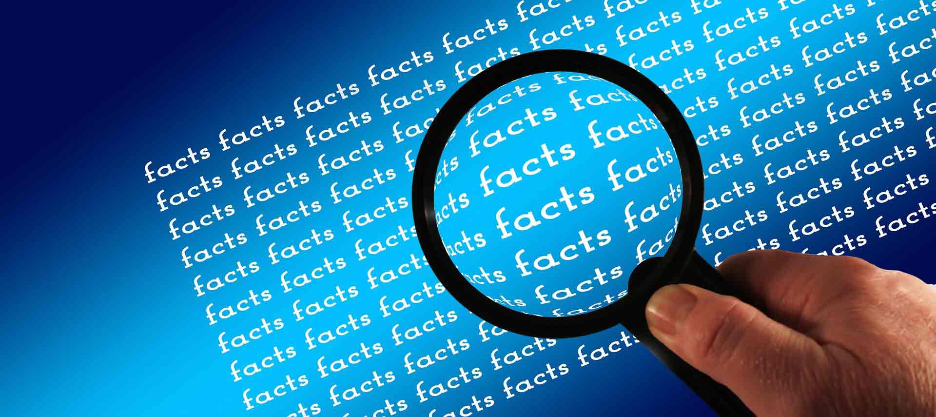 A magnifying glass held up to a screen that says